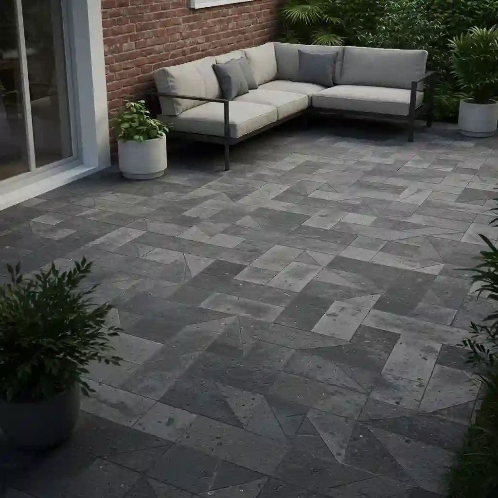A small backyard patio with pavers laid in a diagonal herringbone pattern to make the space feel wider.