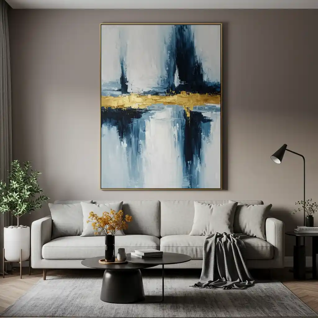 A small apartment living room featuring a single, large-scale, abstract piece of art to create a bold focal point.